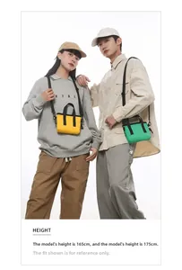 Detail of mini canvas crossbody bags in yellow and green with adjustable black straps