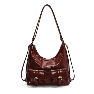 Retro burgundy glossy leather hobo bag with dual front buckle pockets and long strap