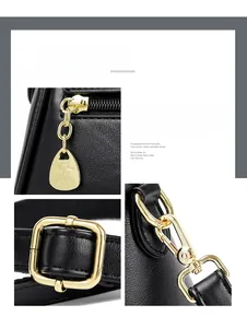 Detail shot of shiny gold-plated metal hardware zipper and strap hooks on black handbag
