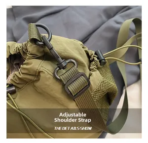 Macro detail of military green nylon drawstring bag with mesh and adjustable strap hook