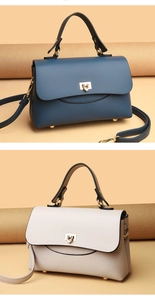 Detailed close-up of premium lychee grain leather handbags with golden twist lock closure