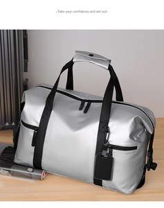 Close-up of silver travel bag with waterproof texture and durable black nylon handles