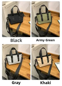 Mini canvas shoulder bags in black, army green, grey and khaki colors on a table