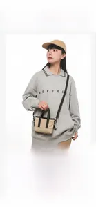 Minimalist canvas mini tote bag shown on model for size and commuting reference