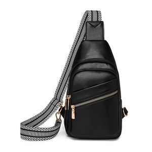 Fashionable black faux leather sling bag with striped woven strap and gold zippers