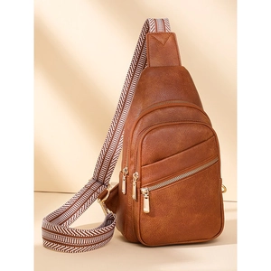 Brown PU leather sling bag with wide patterned strap and triple zipper compartments