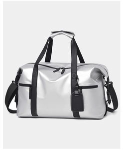 Front view of large silver travel bag with dual zipper pockets and black shoulder strap
