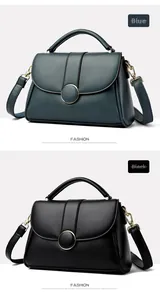 Detail of blue and black leather handbags with gold circular magnetic buckle and hardware