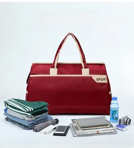 Detailed view of spacious burgundy travel bag showing capacity with various travel essentials