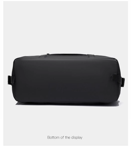 Detailed bottom view of large black waterproof nylon travel bag with reinforced seams