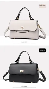 Detailed comparison of light gray and black textured leather handbags with gold buckles