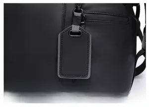 Macro shot of high-quality matte black material with luggage tag and precision zipper