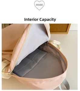 Pink nylon backpack interior showing spacious grey lining and inner pocket compartment