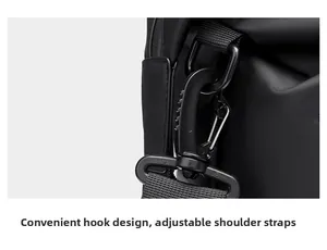 Detail of the adjustable hook system and swivel D-ring on black waterproof travel bag