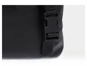 Close-up of durable high-strength plastic buckle on travel bag with matte waterproof fabric