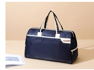 Detail view of navy blue travel bag with durable straps and SPORT printed logo side