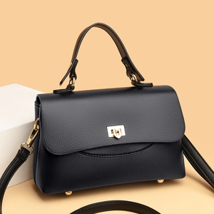 Classic black pebbled leather handbag for women with gold twist lock and crossbody strap