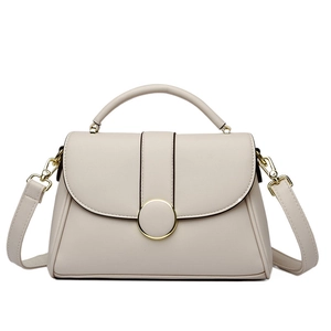 Elegant cream white lychee texture handbag with a round gold buckle and crossbody strap