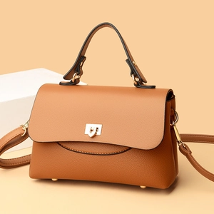 Brown litchi grain leather handbag with gold twist lock and shoulder strap