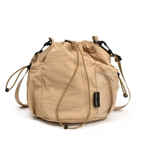 Light khaki nylon bucket bag with drawstring closure and mesh side pocket