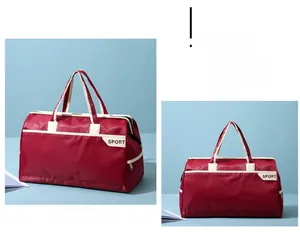 Detailed close-up of dark red travel bag with contrast white handles and SPORT patch