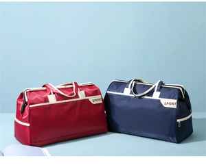 Detail of red and blue large capacity travel bags with SPORT print and durable straps