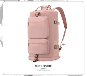 Sac de sport rose en nylon imperméable avec sangles de compression et poches avant