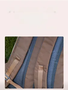 Detail of breathable padded mesh back panel on a large capacity outdoor backpack