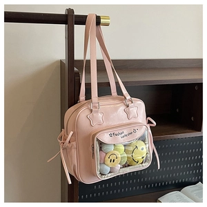 Detailed view of pink ita bag with transparent PVC pocket and Lucky Star star patch