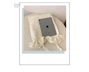Close-up of floral knit tote bag showing spacious interior capacity compared to an iPad