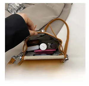 Detailed view of the spacious inner storage of the color-block crossbody bag