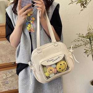 Creamy white PU leather tote bag with transparent PVC window and plush flower charms