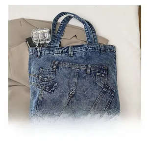 Detail showing high-quality denim tote bag with reconstructed jeans waist and pocket design