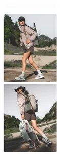 Detailed view of the multi-pocket structure and hiking pole attachment on outdoor backpack