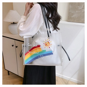 Detail of transparent PVC beach tote with rainbow print and white inner fabric pouch