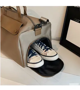 Detail view of large travel bag with independent side zippered shoe compartment