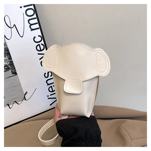 Detail view of cream white elephant shaped mini crossbody bag with fine PU leather texture