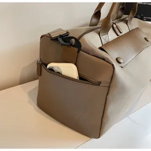 Detail of khaki fitness travel bag side pocket perfectly sized for a smartphone