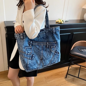 Retro denim tote bag featuring vintage jean pocket details and large capacity for daily use