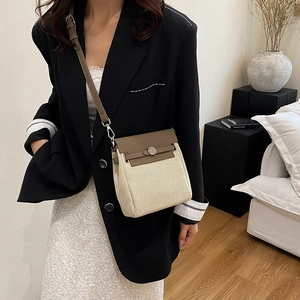 Fashionable large capacity canvas and leather crossbody bag with silver buckle closure