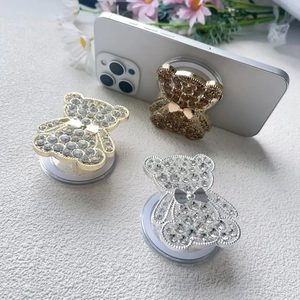 Sparkly bear MagSafe phone stand with rhinestones and metal bow in gold and silver