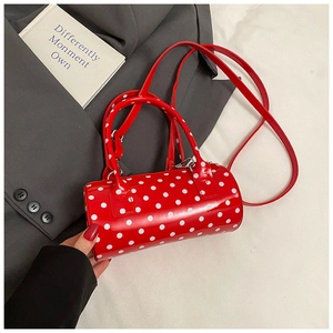 Sac à main cylindrique rouge à pois blancs avec bandoulière amovible élégant