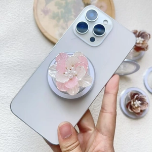 Detail of 3D gradient pearl flower MagSafe phone stand with silver rim petals