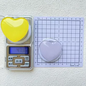 Macro view showing the 5.5cm diameter and 47.36g weight of heart MagSafe phone stand