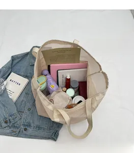 Macro shot of large capacity mesh tote bag interior showing spacious storage space
