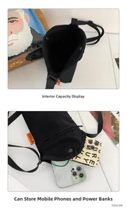 Detail of multi-functional black canvas phone crossbody bag with internal storage compartments