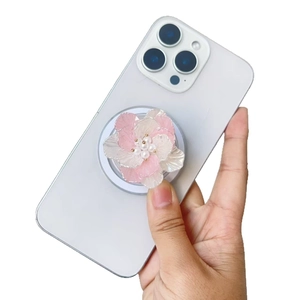Gradient pink pearl flower MagSafe phone socket holder shown on a white smartphone