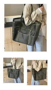 Detail of army green mesh beach tote showing multiple exterior storage pockets and texture