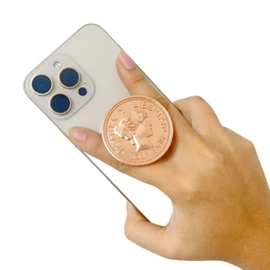 Rose gold magnetic phone socket with vintage coin relief showing a profile portrait