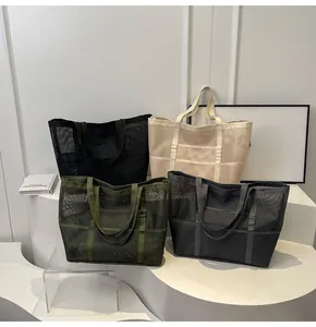 Detailed display of four colorful mesh tote bags showing breathable fabric and large capacity
